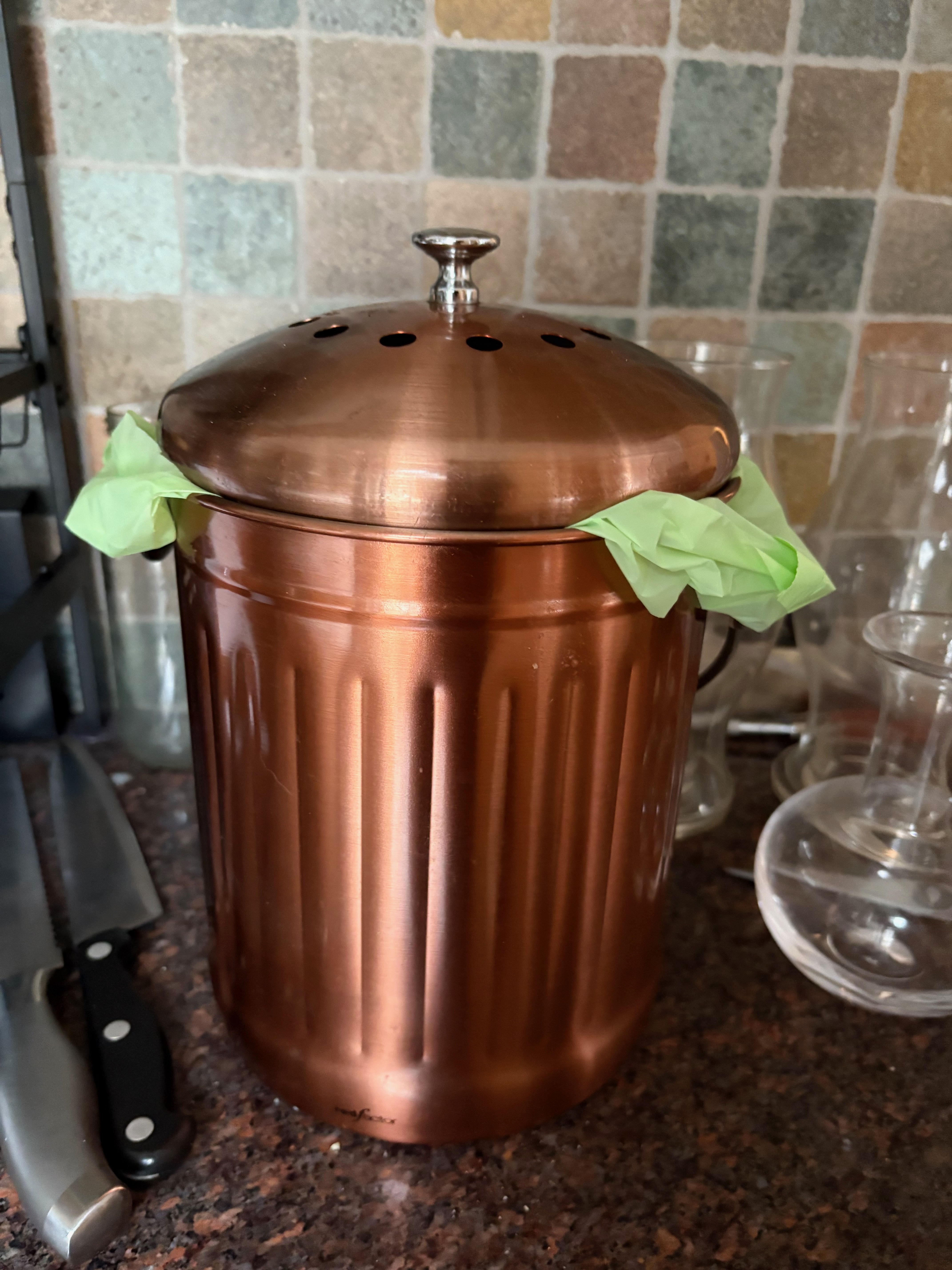 brass-colored compost bin