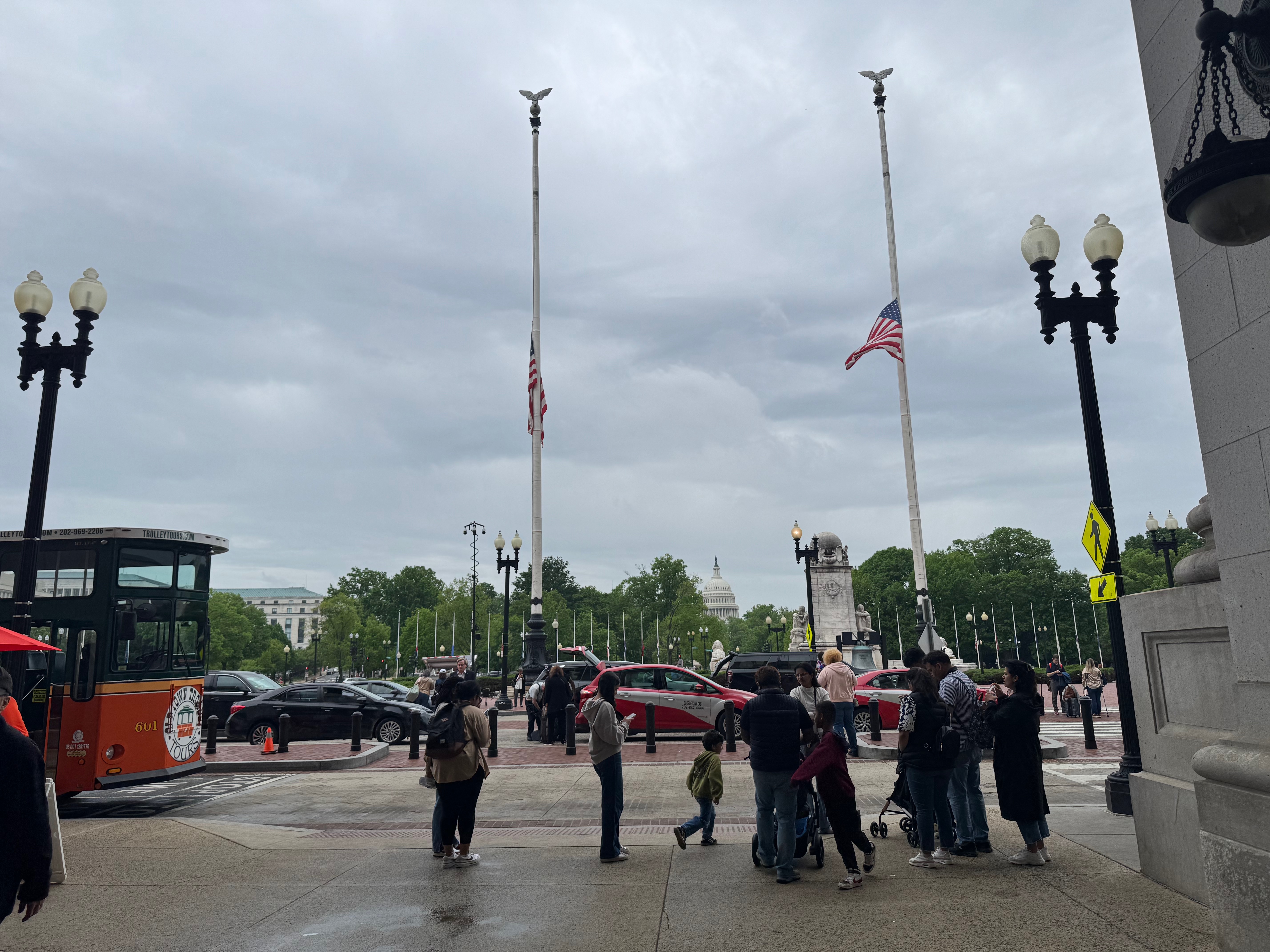 exiting Washington DC’s Union Station, flagpoles and Capitol Building in the distance