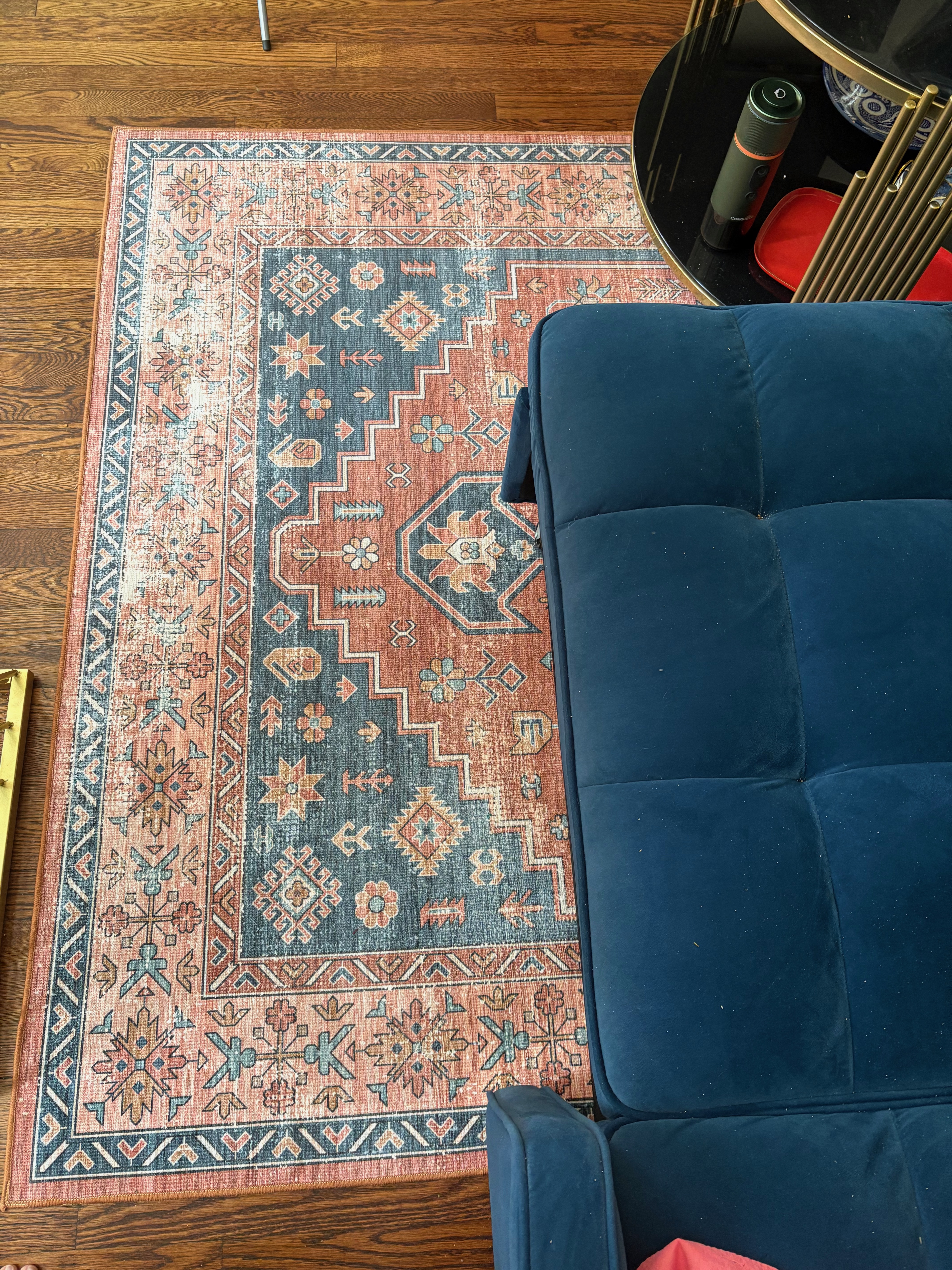 Living area rug, slightly underneath the couch